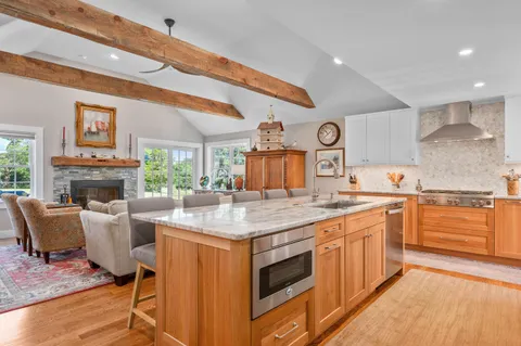 a kitchen with stainless steel appliances granite countertop a sink and cabinets