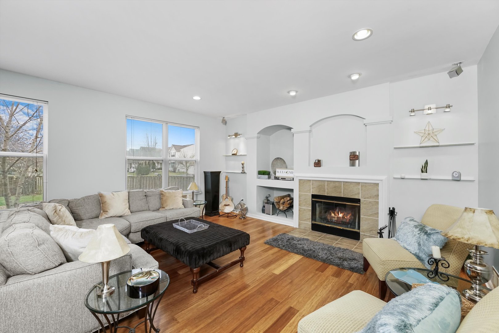 351 Claridge Circle Bolingbrook, IL 60440 - Photo 11 of 32 a living room with furniture fireplace and a window