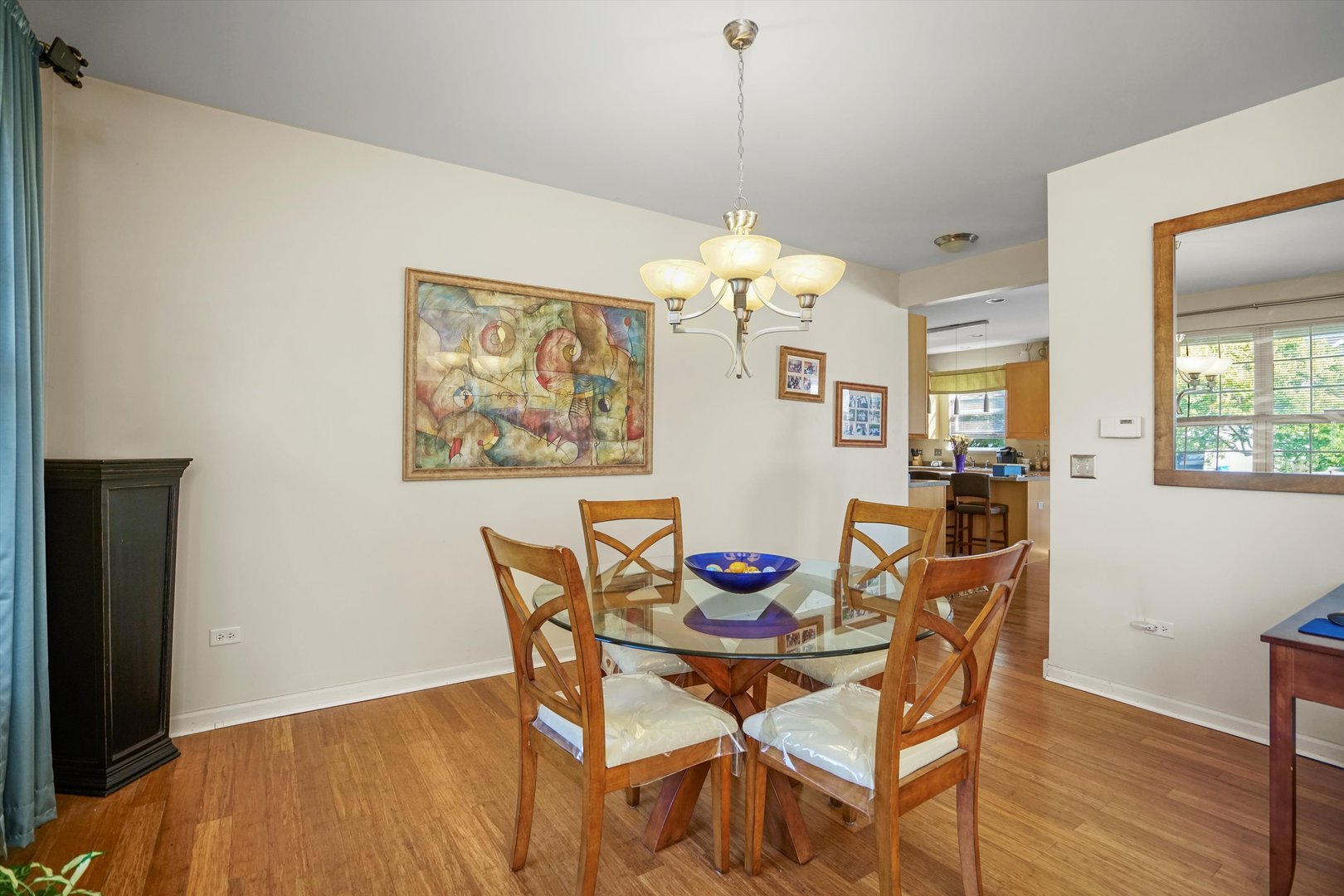 351 Claridge Circle Bolingbrook, IL 60440 - Photo 8 of 32 a view of a dining room with furniture wooden floor and a chandelier