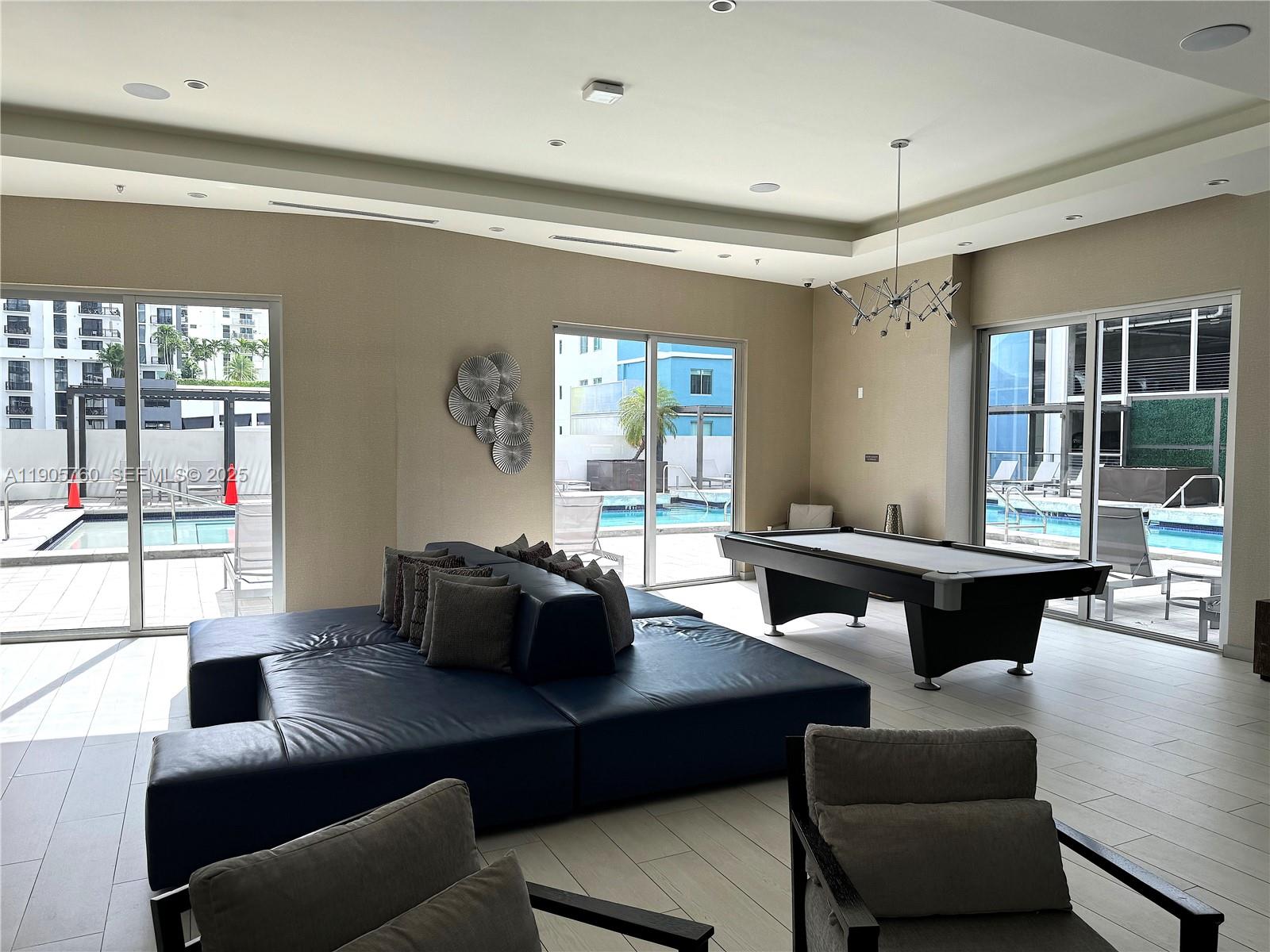 1010 Southwest 2nd Avenue, Unit 910 Miami, FL 33130 - Photo 29 of 32 a living room with furniture and a large window