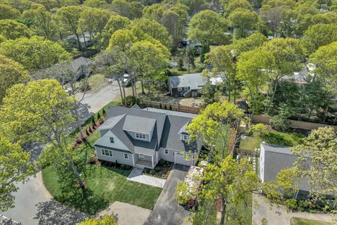 an aerial view of a house with a garden