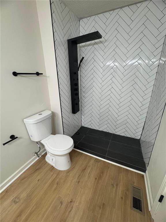 1753 Lee Street Decatur, GA 30035 - Photo 11 of 17 a bathroom with a toilet and a shower