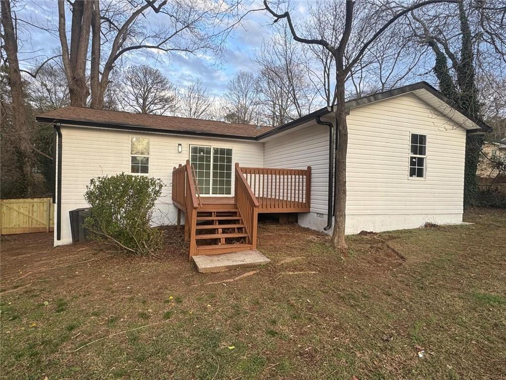 1753 Lee Street Decatur, GA 30035 - Photo 17 of 17 a view of a house with backyard and a tree