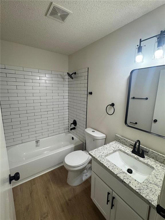 1753 Lee Street Decatur, GA 30035 - Photo 9 of 17 a bathroom with a granite countertop sink a toilet and bathtub