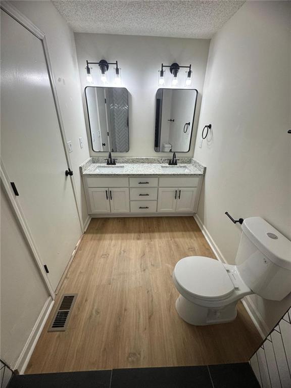 1753 Lee Street Decatur, GA 30035 - Photo 10 of 17 a bathroom with a toilet sink and mirror