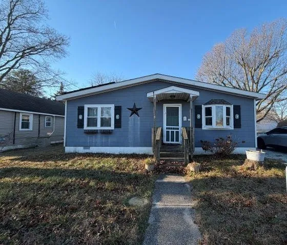 a front view of a house with yard