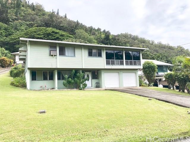 2813 Booth Road Honolulu, HI 96813 - Photo 1 of 1 a front view of a house with a yard