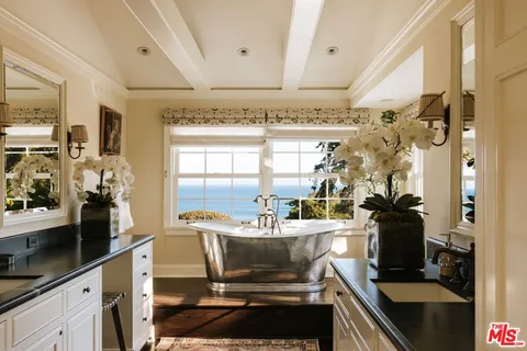 a bedroom with bed and window