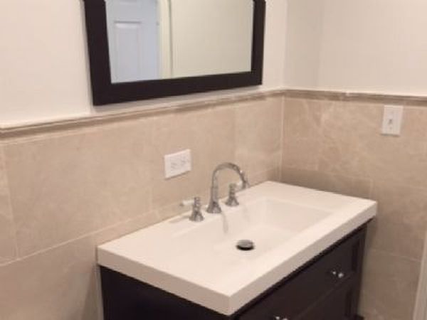 622 West Briar Place, Unit G Chicago, IL 60657 - Photo 9 of 16 a bathroom with a sink and a mirror