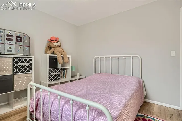a bedroom with a bed and cabinets