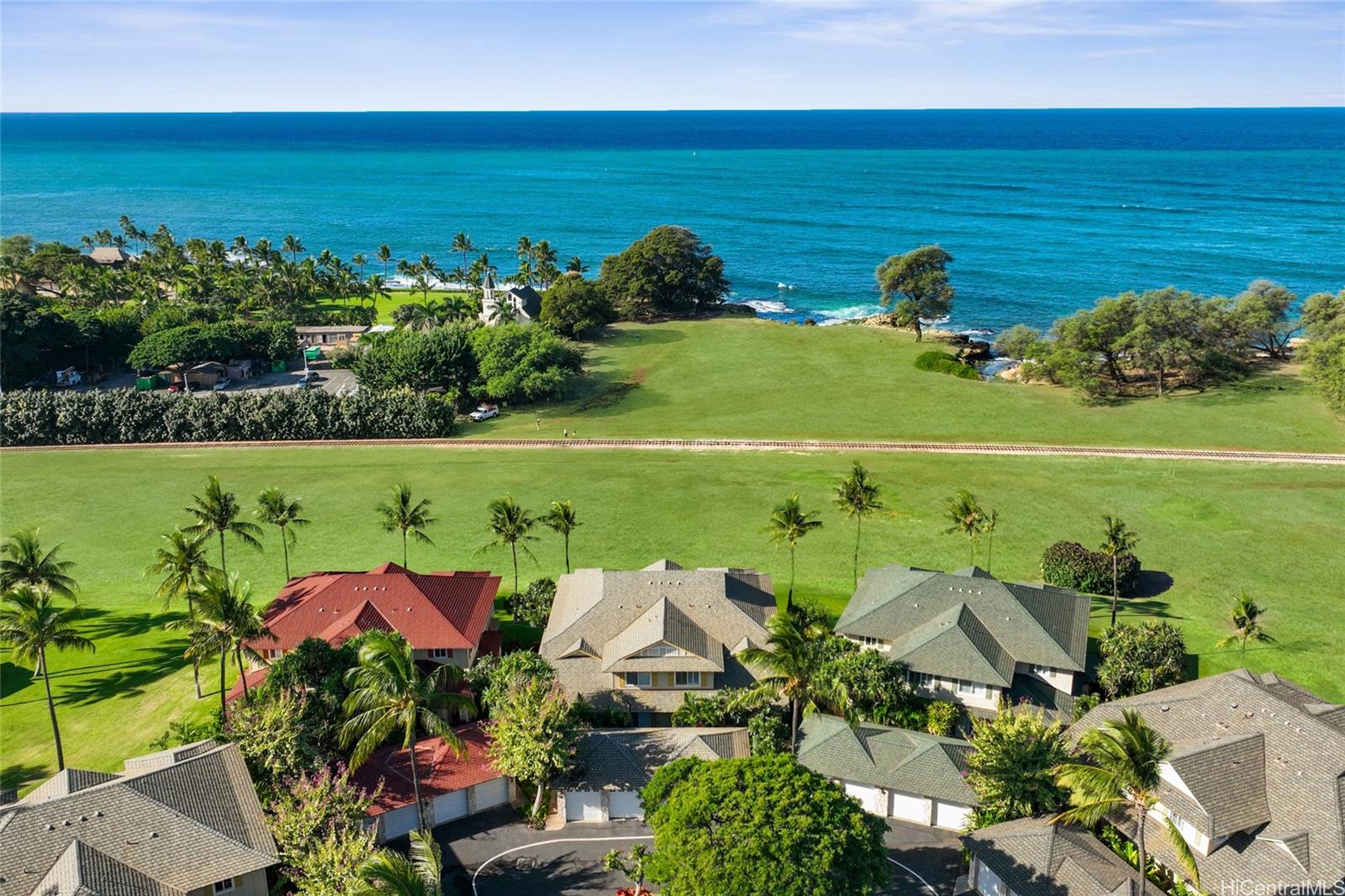 92-1001 Aliinui Drive, Unit 25C Kapolei, HI 96707 - Photo 1 of 25 an aerial view of a houses with a lake view