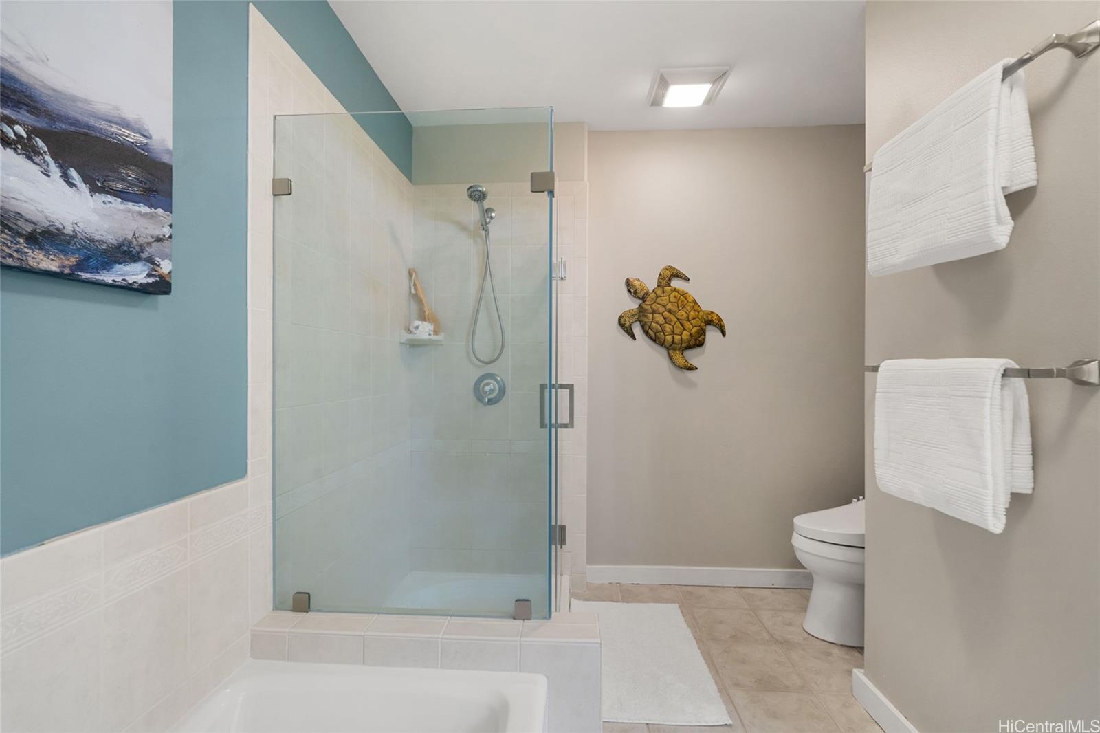 92-1001 Aliinui Drive, Unit 25C Kapolei, HI 96707 - Photo 12 of 25 a bathroom with a shower and toilet