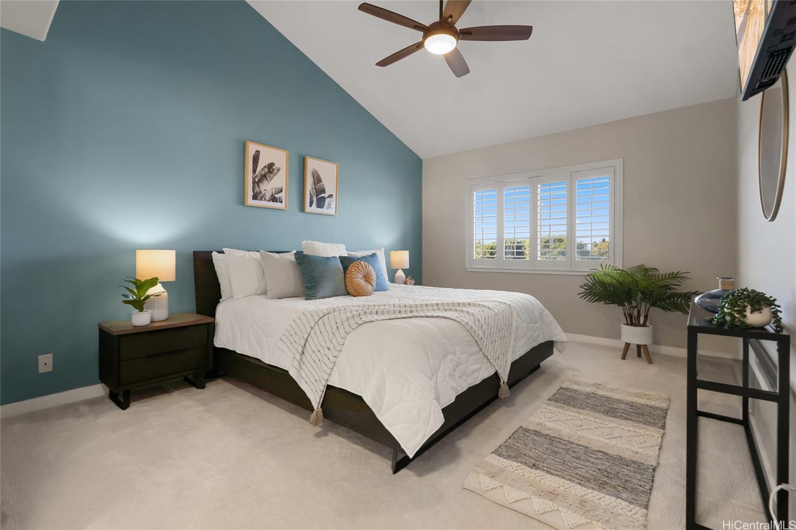 92-1001 Aliinui Drive, Unit 25C Kapolei, HI 96707 - Photo 8 of 25 a bedroom with a bed lamp and a potted plant on dresser