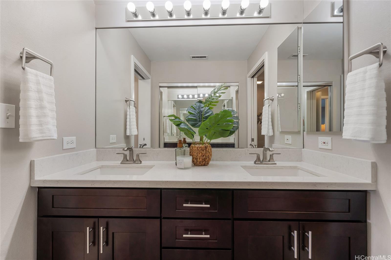 92-1001 Aliinui Drive, Unit 25C Kapolei, HI 96707 - Photo 10 of 25 a bathroom with a sink and a mirror