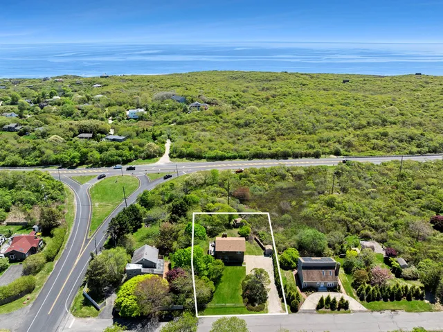 a view of a yard with an ocean