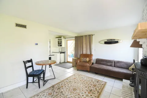 a living room with furniture and a rug