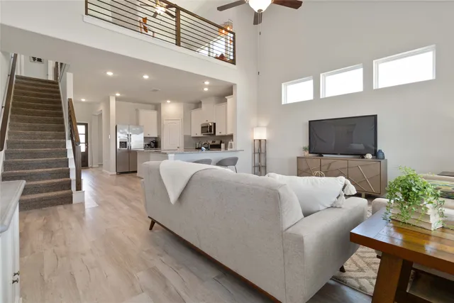 a bedroom with a bed window and a couch