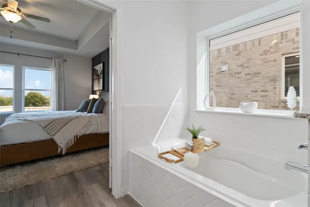 a bathroom with a bathtub and a shower