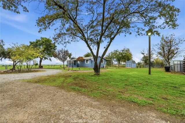 wooden floor in an empty room with a kitchen