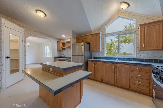 a view of a park with large trees