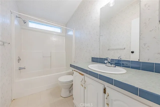 a view of a backyard with large trees