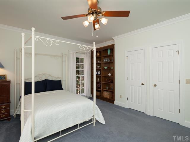 1929 Partridge Berry Drive Raleigh, NC 27606 - Photo 13 of 25 Visiting guests will enjoy staying in the first floor guest bedroom that offers His & Her closets. Bedroom