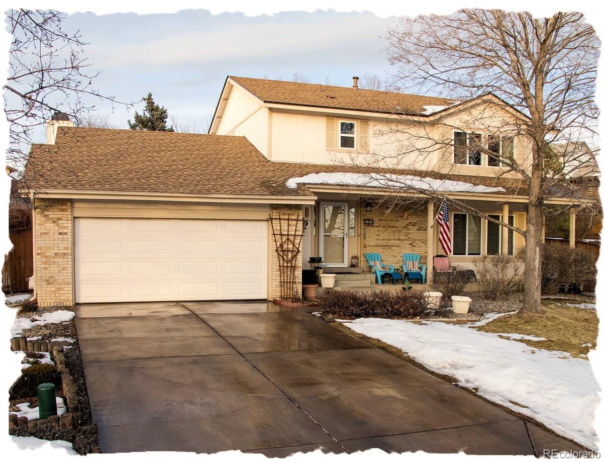 581 Mountain Chickadee Road Highlands Ranch, CO 80126 - Photo 1 of 1 a view of a white house with large windows next to a road