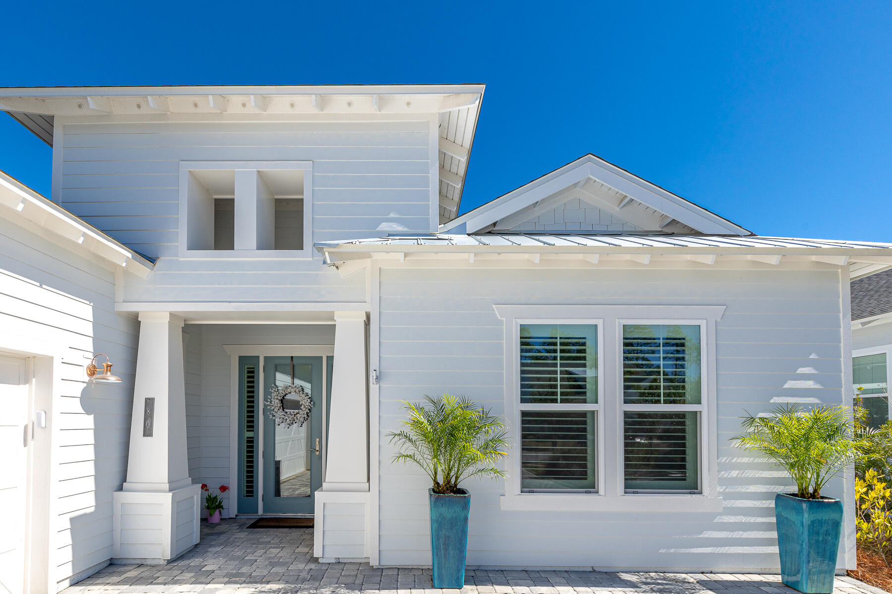 80 River Rise Way Inlet Beach Inlet Beach, FL 32461 - Photo 3 of 46 a front view of a house with potted plants