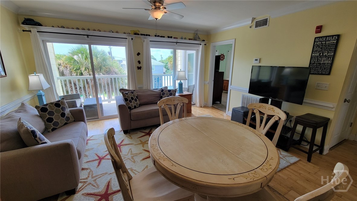 18 Silver Avenue, Unit 4 Tybee Island, GA 31328 - Photo 2 of 20 Living room and dining area with beach feel - opens to porch. Bamboo floorings - sold turn key