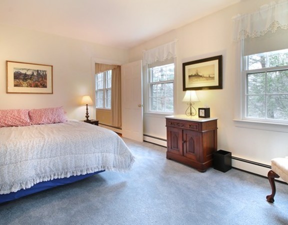 6 Page Farm Road Lincoln, MA 01773 - Photo 11 of 21 a spacious bedroom with a bed and a window