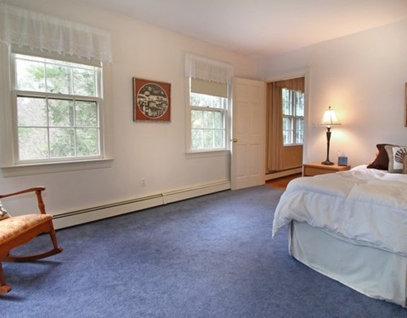 6 Page Farm Road Lincoln, MA 01773 - Photo 12 of 21 a spacious bedroom with a bed and a window