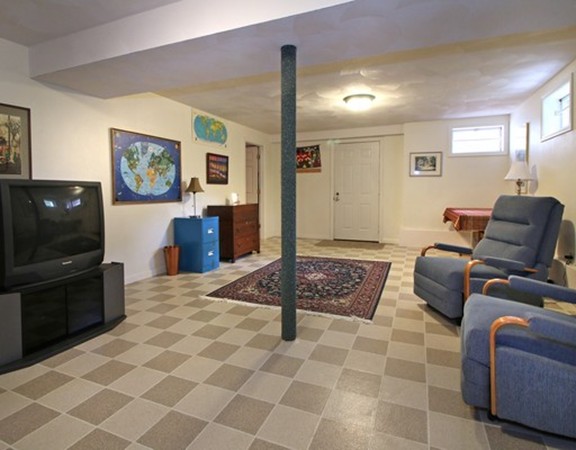 6 Page Farm Road Lincoln, MA 01773 - Photo 16 of 21 a living room with furniture and a flat screen tv