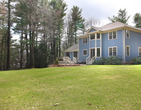 6 Page Farm Road Lincoln, MA 01773 - Photo 21 of 21 a front view of house with yard and trees in the background