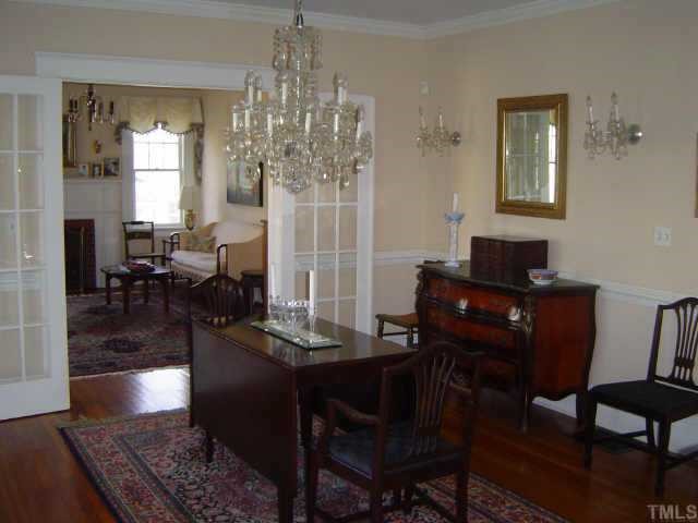 2106 Cowper Drive Raleigh, NC 27608 - Photo 5 of 12 a view of a dining room with furniture and chandelier