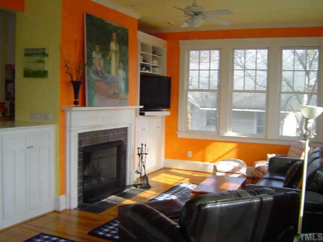 2106 Cowper Drive Raleigh, NC 27608 - Photo 7 of 12 a living room with furniture and a fireplace