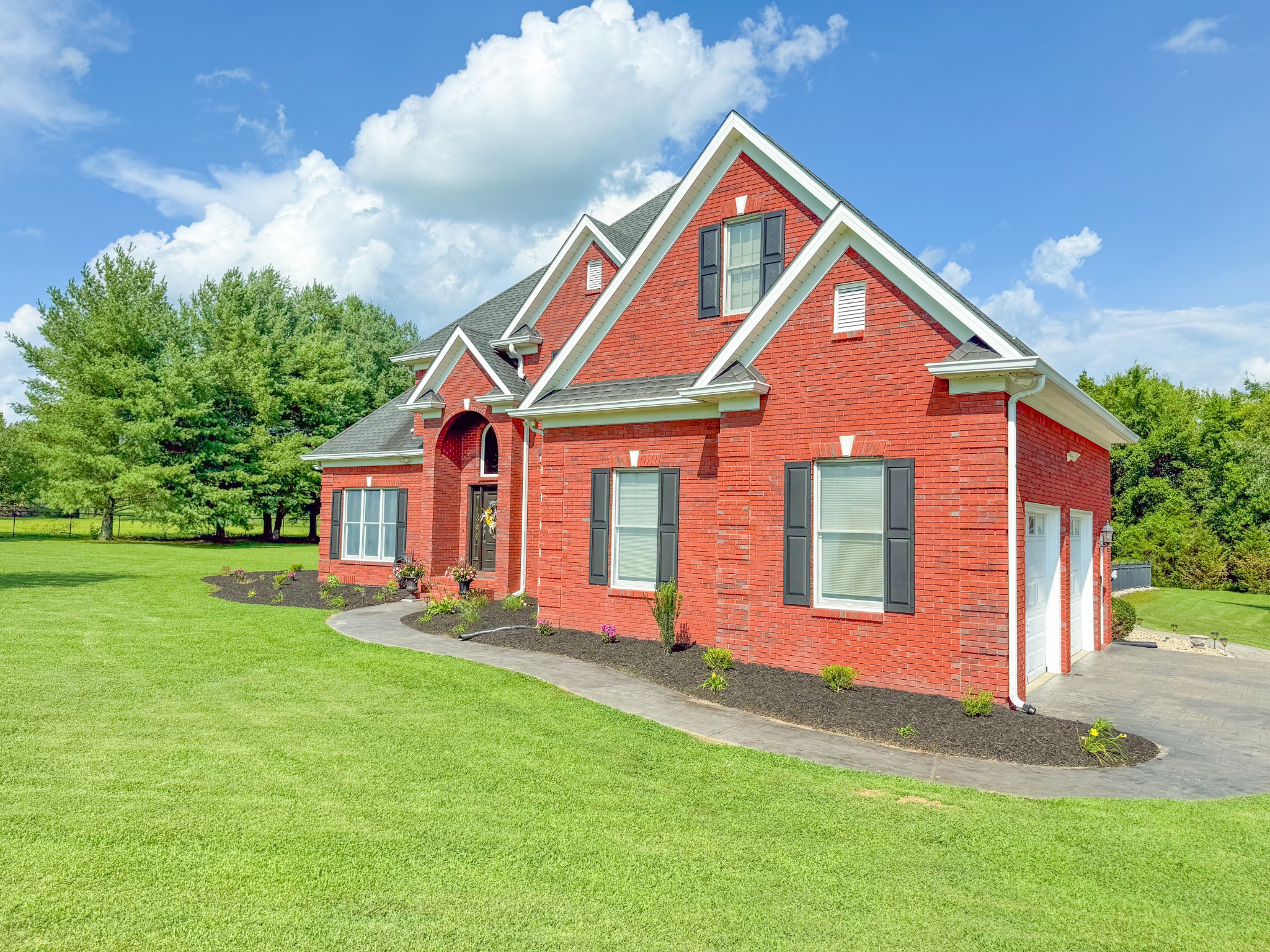 275 Crescentview Road Pulaski, TN 38478 - Photo 58 of 62 a front view of a house with a yard and garage