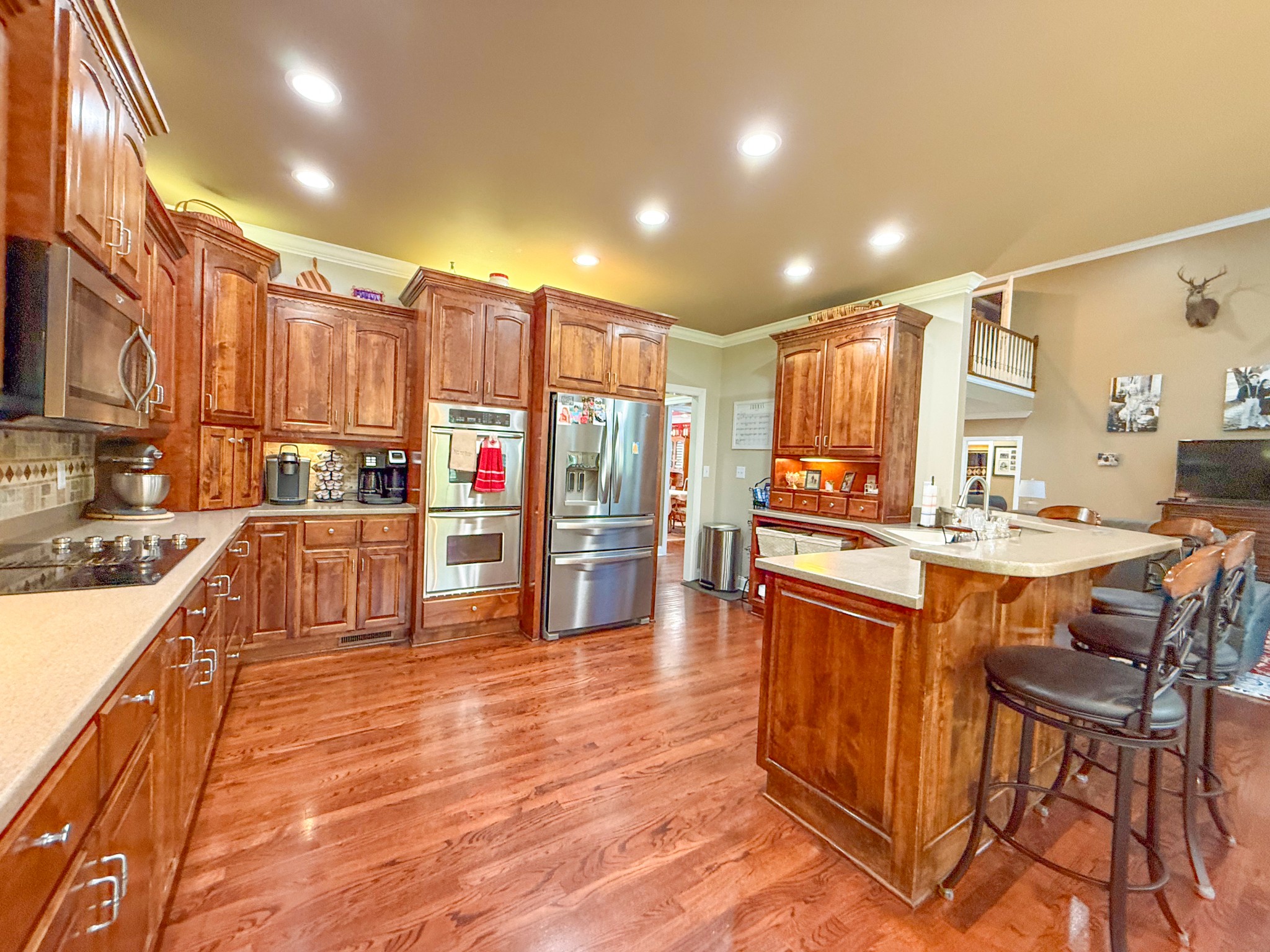 275 Crescentview Road Pulaski, TN 38478 - Photo 7 of 62 a kitchen with stainless steel appliances kitchen island granite countertop a table chairs and a refrigerator