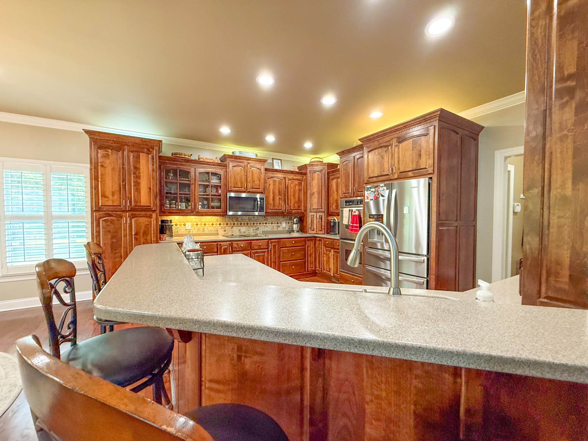 275 Crescentview Road Pulaski, TN 38478 - Photo 9 of 62 a kitchen with stainless steel appliances kitchen island granite countertop a sink and cabinets