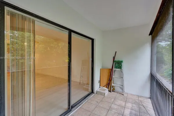 a view of a bathroom with a tub and mirror