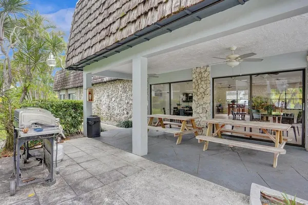a view of a swimming pool with a patio