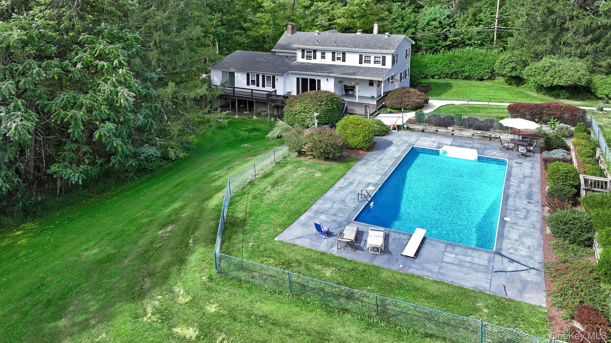 a front view of a house with a yard table and chairs