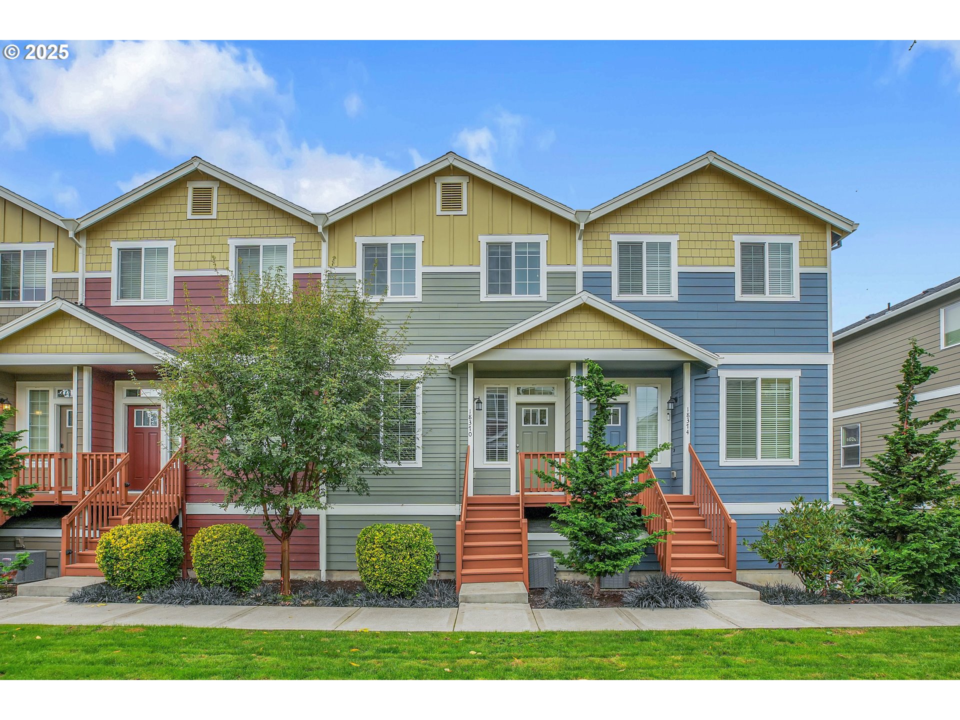 18370 Southwest Anna Mae Lane Beaverton, OR 97003 - Photo 1 of 29 a view of a yard in front of a house with large windows