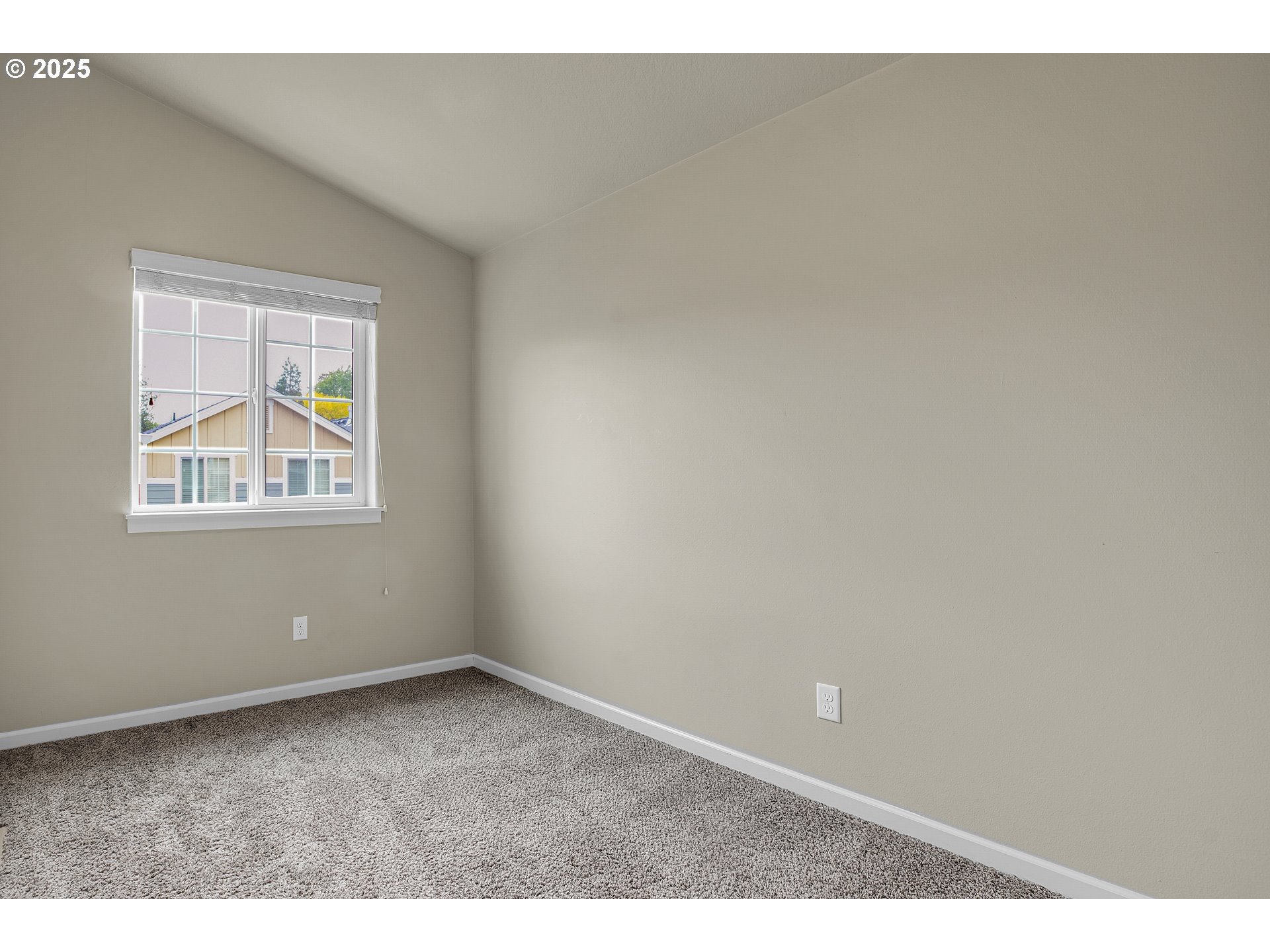 18370 Southwest Anna Mae Lane Beaverton, OR 97003 - Photo 19 of 29 a view of an empty room with a window