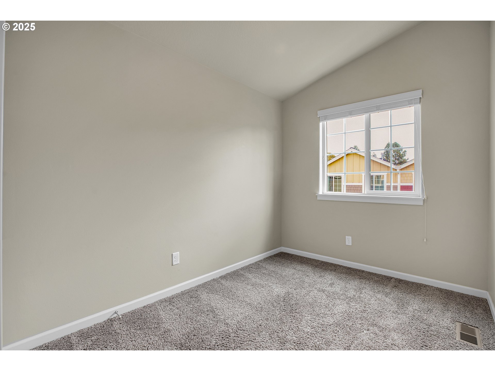 18370 Southwest Anna Mae Lane Beaverton, OR 97003 - Photo 23 of 29 a view of an empty room with a window