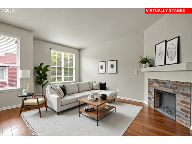 a living room with furniture a window and a fireplace