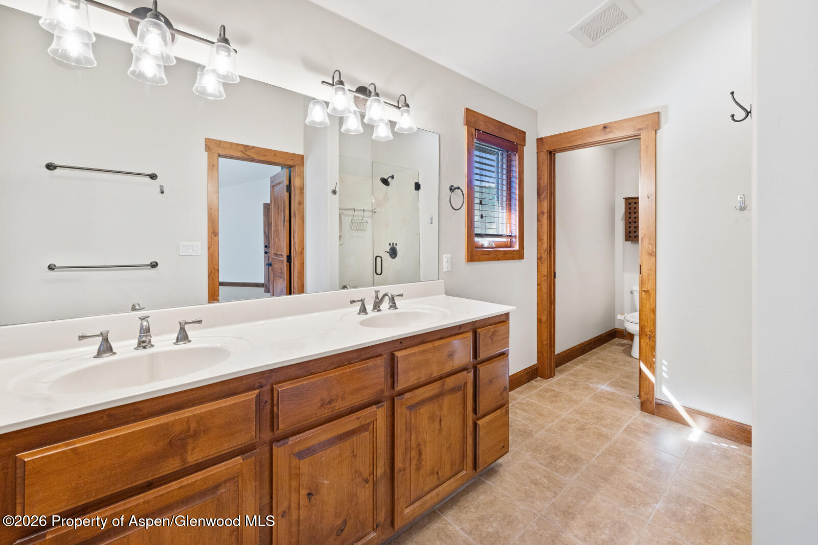 316 Faas Ranch Road New Castle, CO 81647 - Photo 24 of 50 a spacious bathroom with a double vanity sink mirror and double