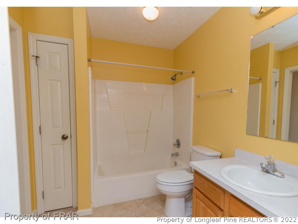 1941-3 Sardonyx Road Fayetteville, NC 28303 - Photo 21 of 27 a bathroom with a toilet a sink and shower