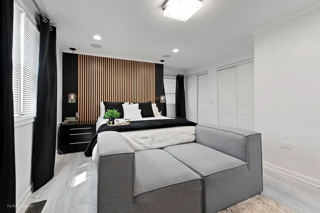 a bedroom with a bed and a window