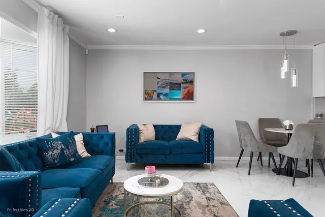 a living room with furniture and a rug