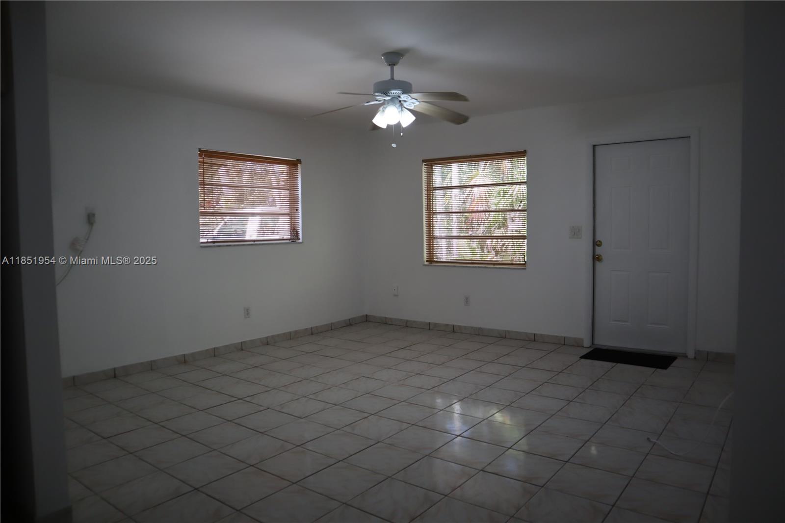 18531 Southwest 268th Street, Unit 18531 Homestead, FL 33031 - Photo 12 of 18 a view of an empty room with a window